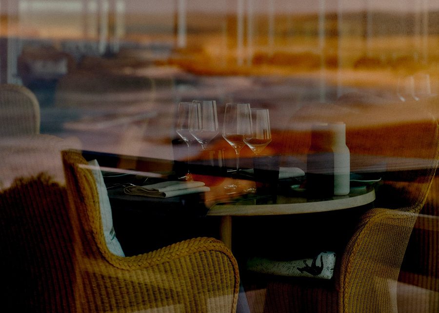 Warm dining setting with sunset reflections